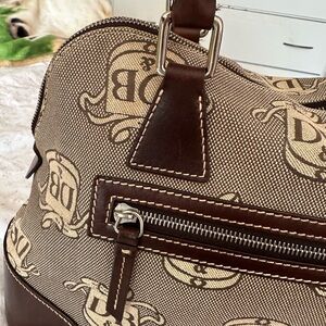 Beautiful Dooney & Bourke signature canvas and leather domed satchel.